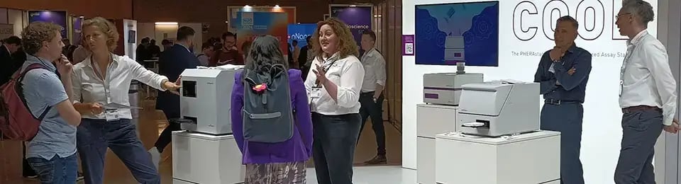 A lot of different people at an exhibition