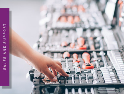 A hand that searches for tools in a tool case