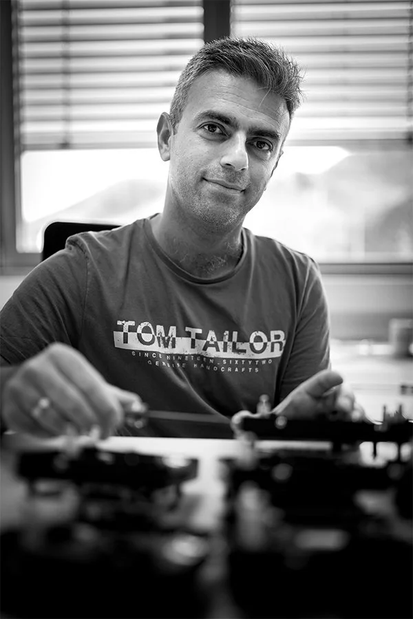Syamand Ismail in front of some tools Syamand Ismail in front of some tools