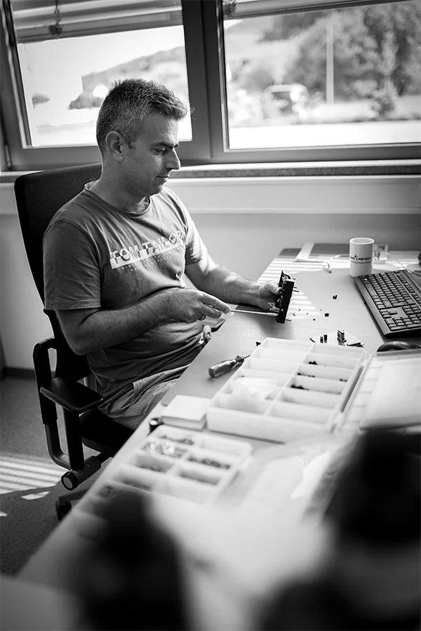 Syamand Ismail sitting on his desk Syamand Ismail sitting on his desk